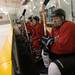 The Washtenaw County firefighter hockey team watches the game while waiting for a line change.
Courtney Sacco I AnnArbor.com  